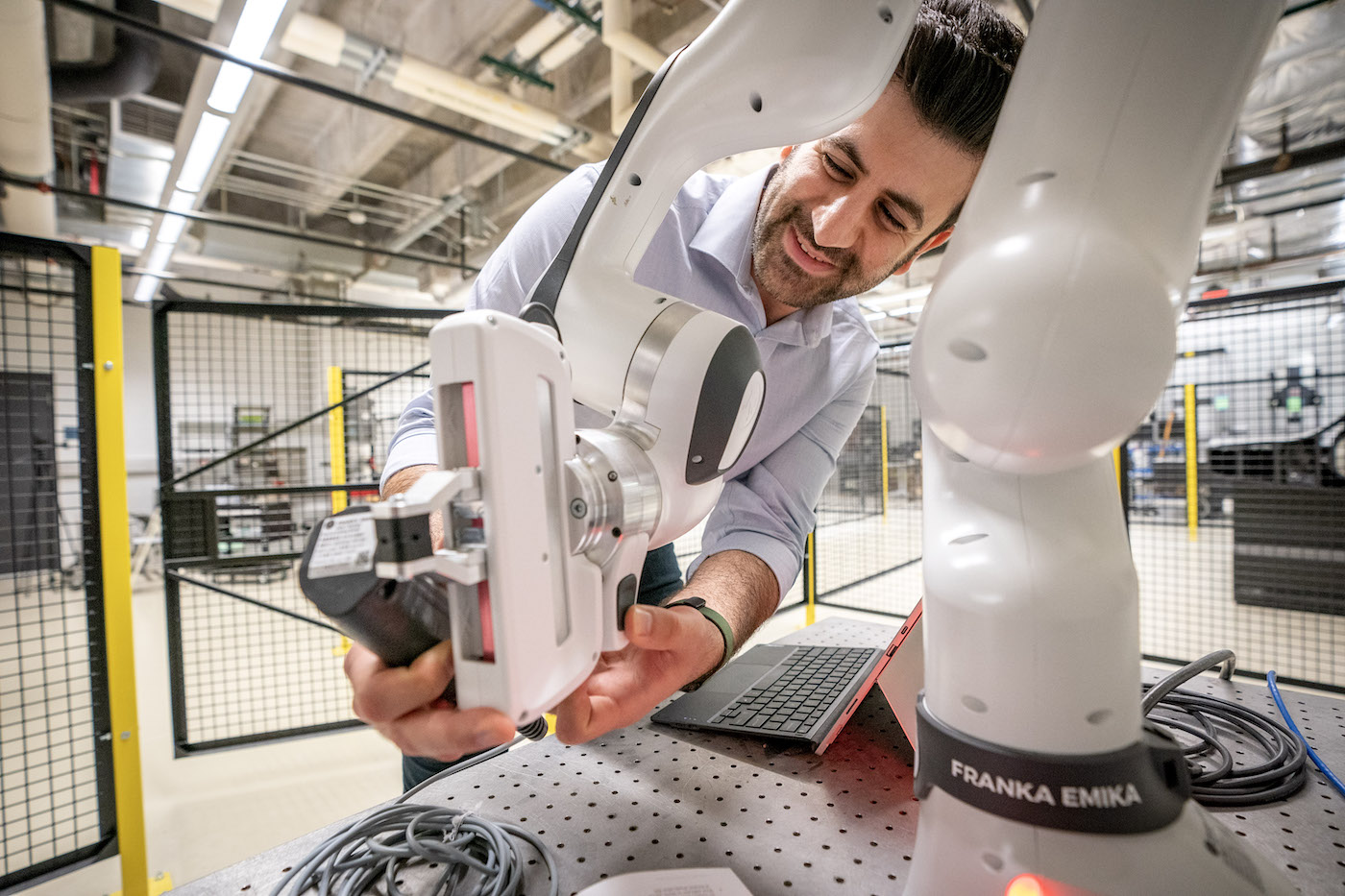Man working on robot in CDHAM